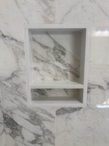 marble shower backsplash and soap holder