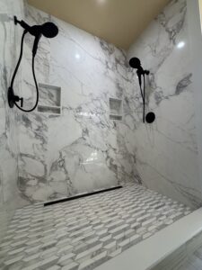 dual head shower with marble walls