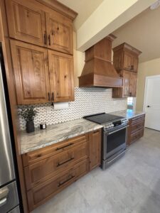 marble kitchen countertops and dark wood cabinets
