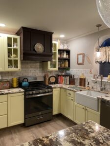 kitchen with marble countertops and yellow cabinets